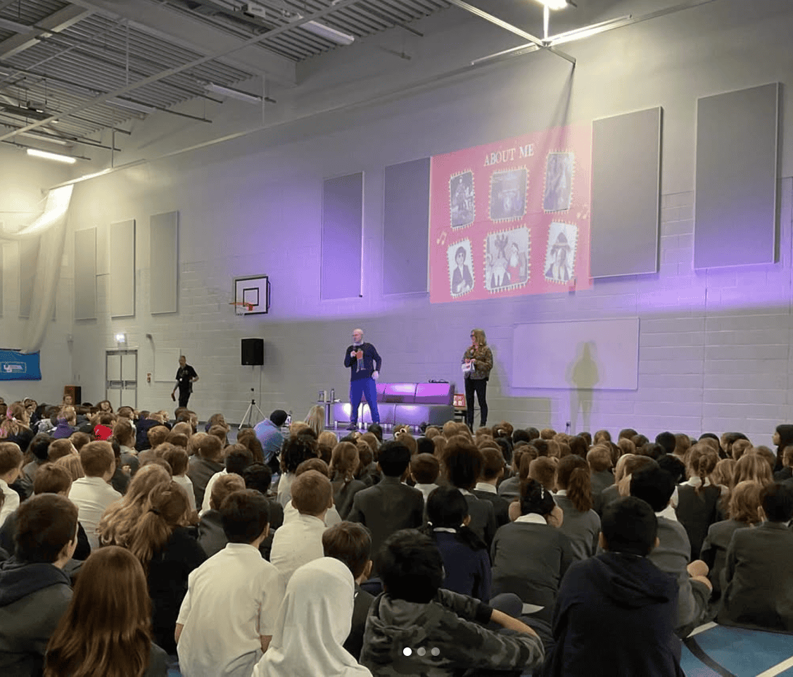 Image of pupils in assembly with Matt Lucas