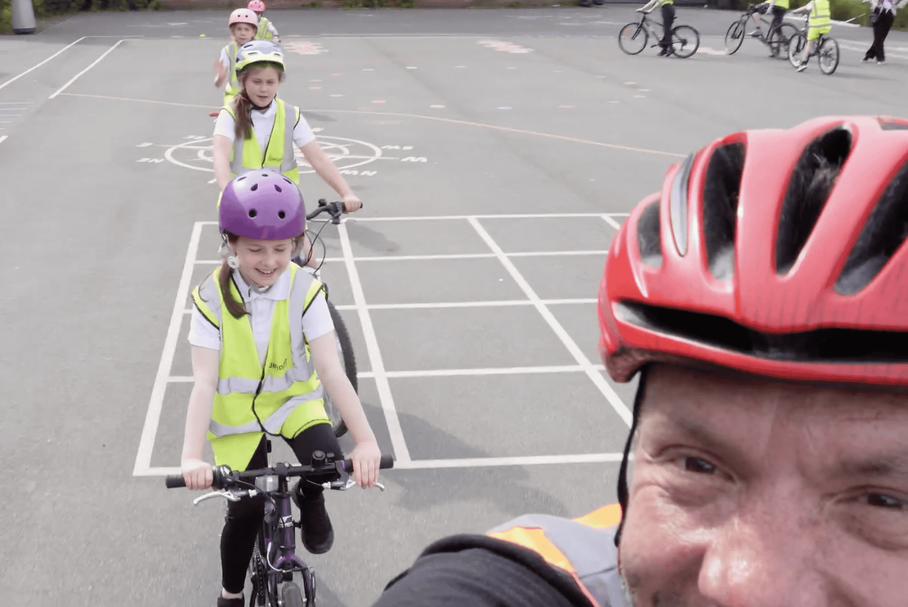 Children and staff riding bikes